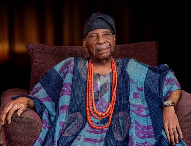 Pa Reuben Famuyide Fasoranti seated in traditional attire and coral beads.